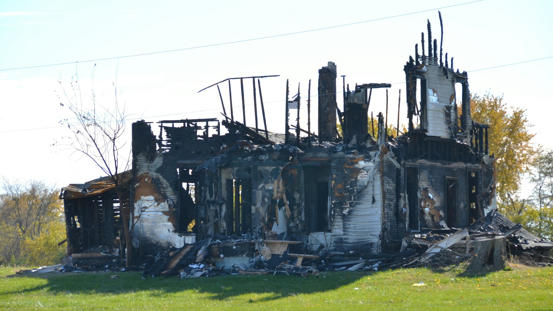 Loss adjuster documenting property damage with a professional camera